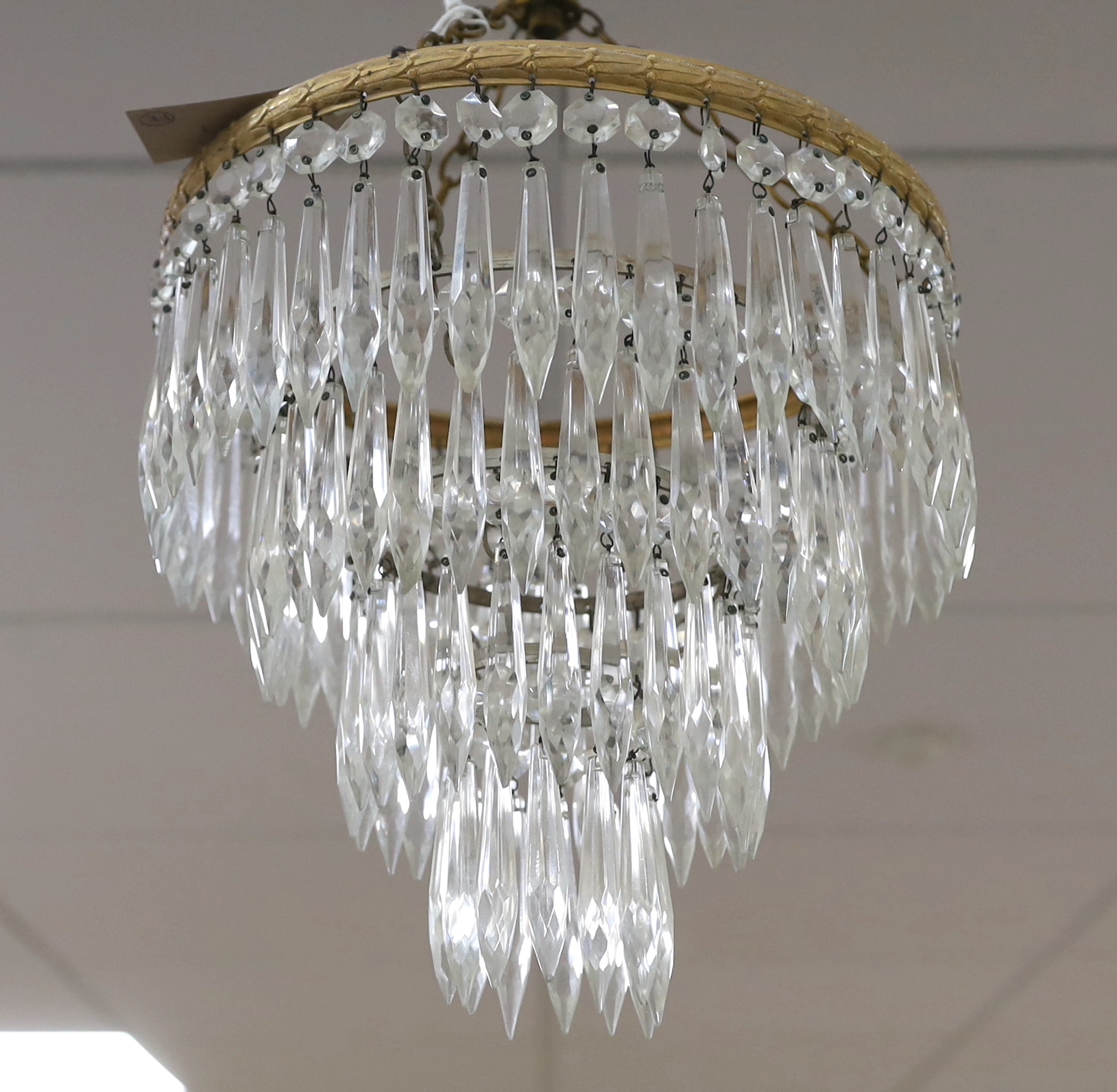 A pair of cut glass four tier chandeliers, 26.5cm wide